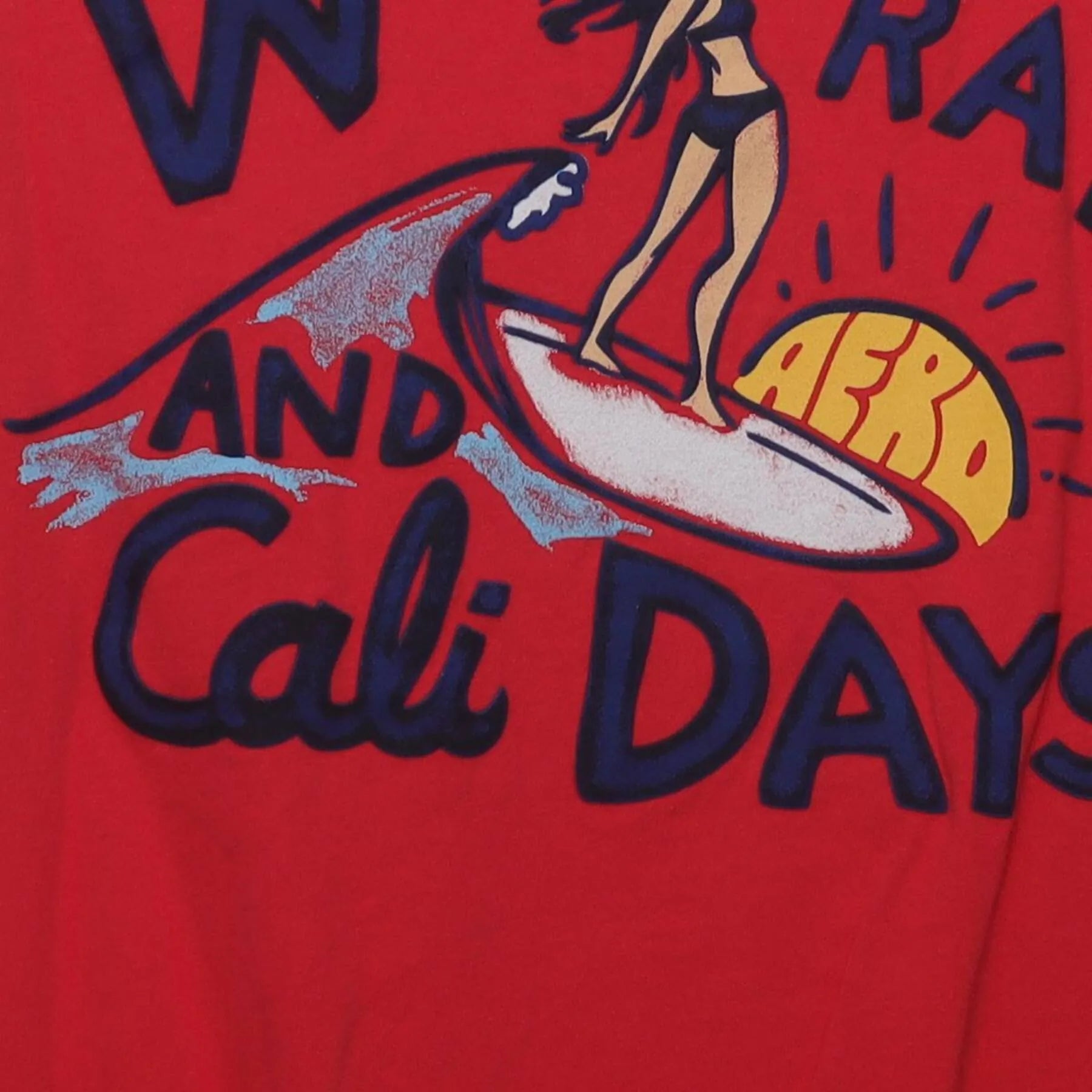 Close-up of the Right sleeve on the Vintage Y2K Aéropostale "Waves, Rays, and Cali Days" Surfer Graphic T-Shirt