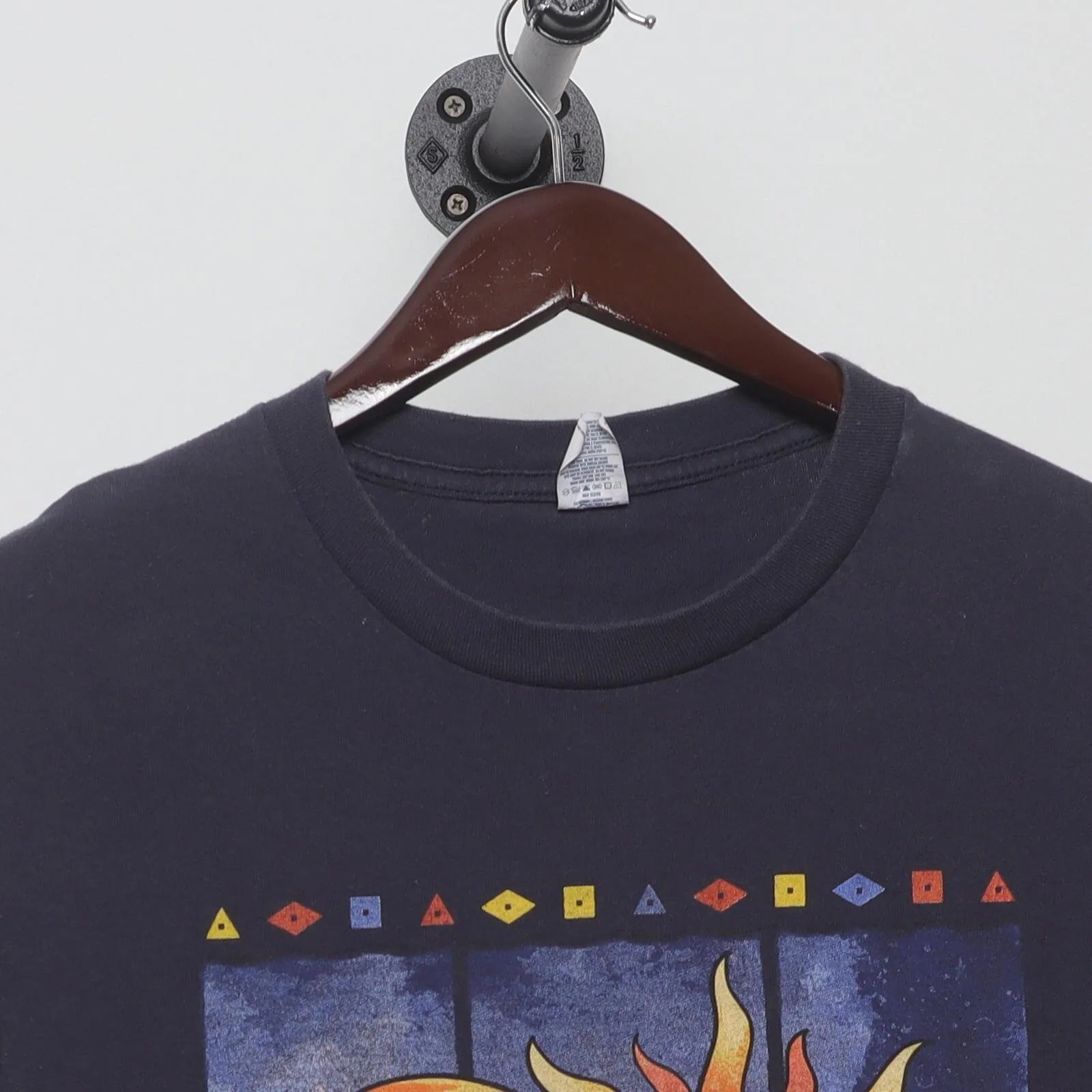 Close-up of the collar and tag on the Vintage Y2K Anvil "Celestial Sun & Moon" T-Shirt - L