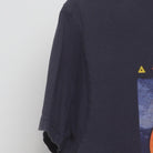 Close-up of the sleeve on the Vintage Y2K Anvil "Celestial Sun & Moon" T-Shirt - L