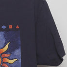 Close-up of the sleeve on the Vintage Y2K Anvil "Celestial Sun & Moon" T-Shirt - L