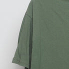 Close-up of the sleeve on the Vintage Y2K Baddest Mudrun "Welcome to the Badlands" T-Shirt - XL