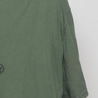 Close-up of the sleeve on the Vintage Y2K Baddest Mudrun "Welcome to the Badlands" T-Shirt - XL