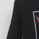 Close-up of the sleeve on the Vintage Y2K Bob Marley "Live Performance" T-Shirt - M