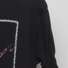 Close-up of the sleeve on the Vintage Y2K Bob Marley "Live Performance" T-Shirt - M