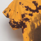 Close-up of the sleeve on the Vintage Y2K Bubba Gump Shrimp Co. "Winking Smiley" T-Shirt - XS