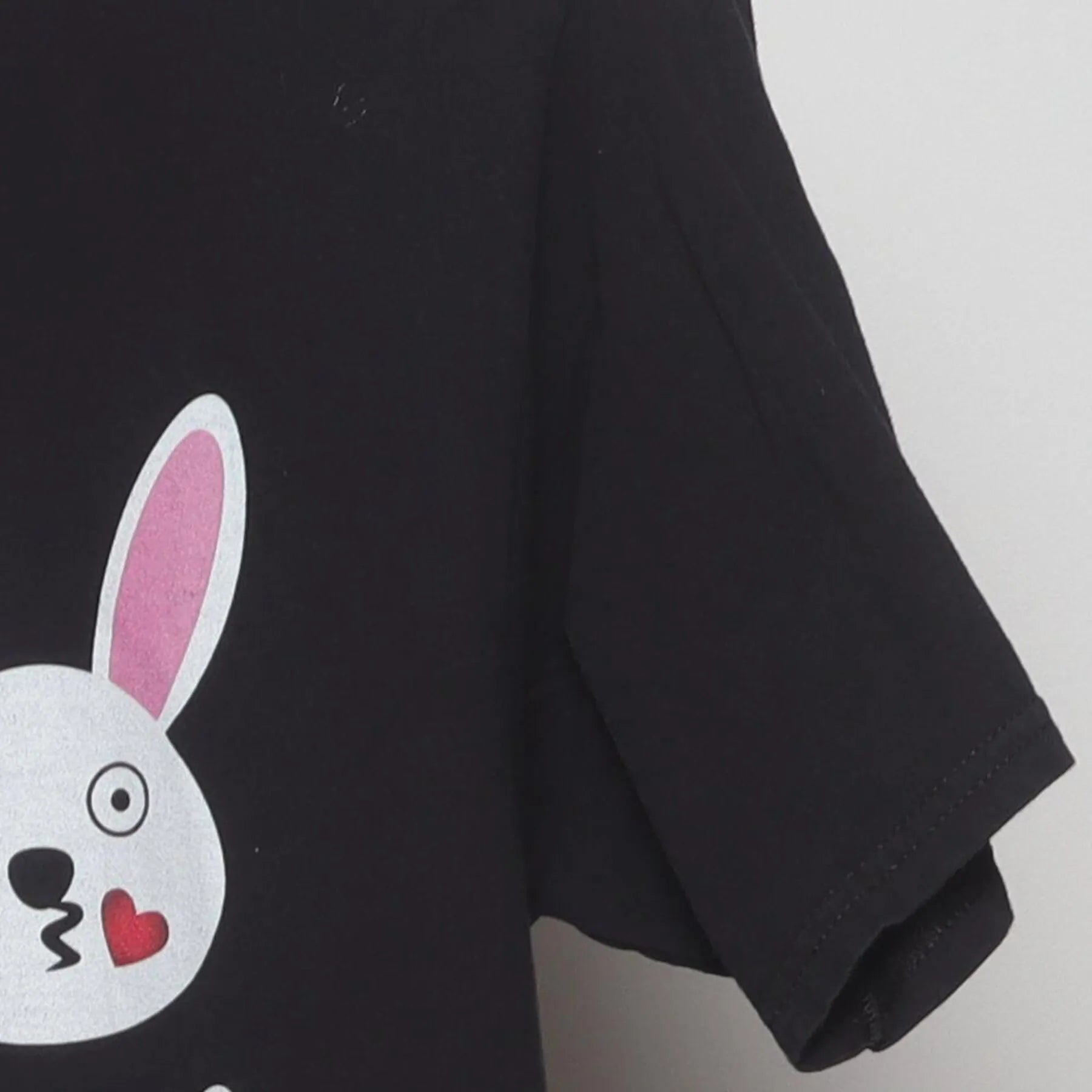 Close-up of the Right sleeve on the Vintage Y2K Gildan "Bunny Emojis" T-Shirt - S