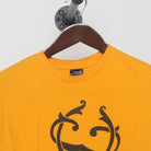 Close-up of the collar and tag on the Vintage Y2K Crooks & Castles "Running Crook Mascot" T-Shirt - M