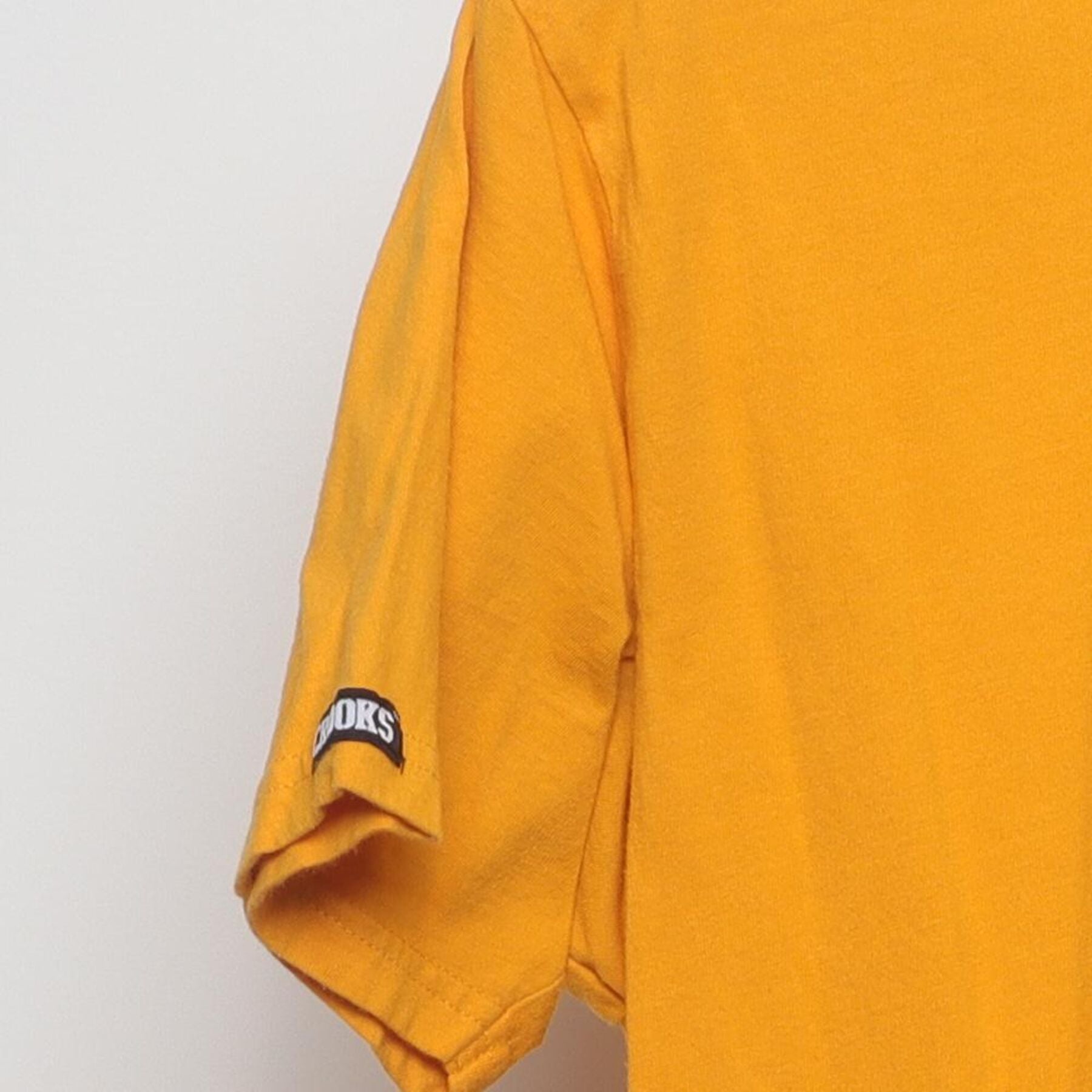 Close-up of the Left sleeve on the Vintage Y2K Crooks & Castles "Running Crook Mascot" T-Shirt - M