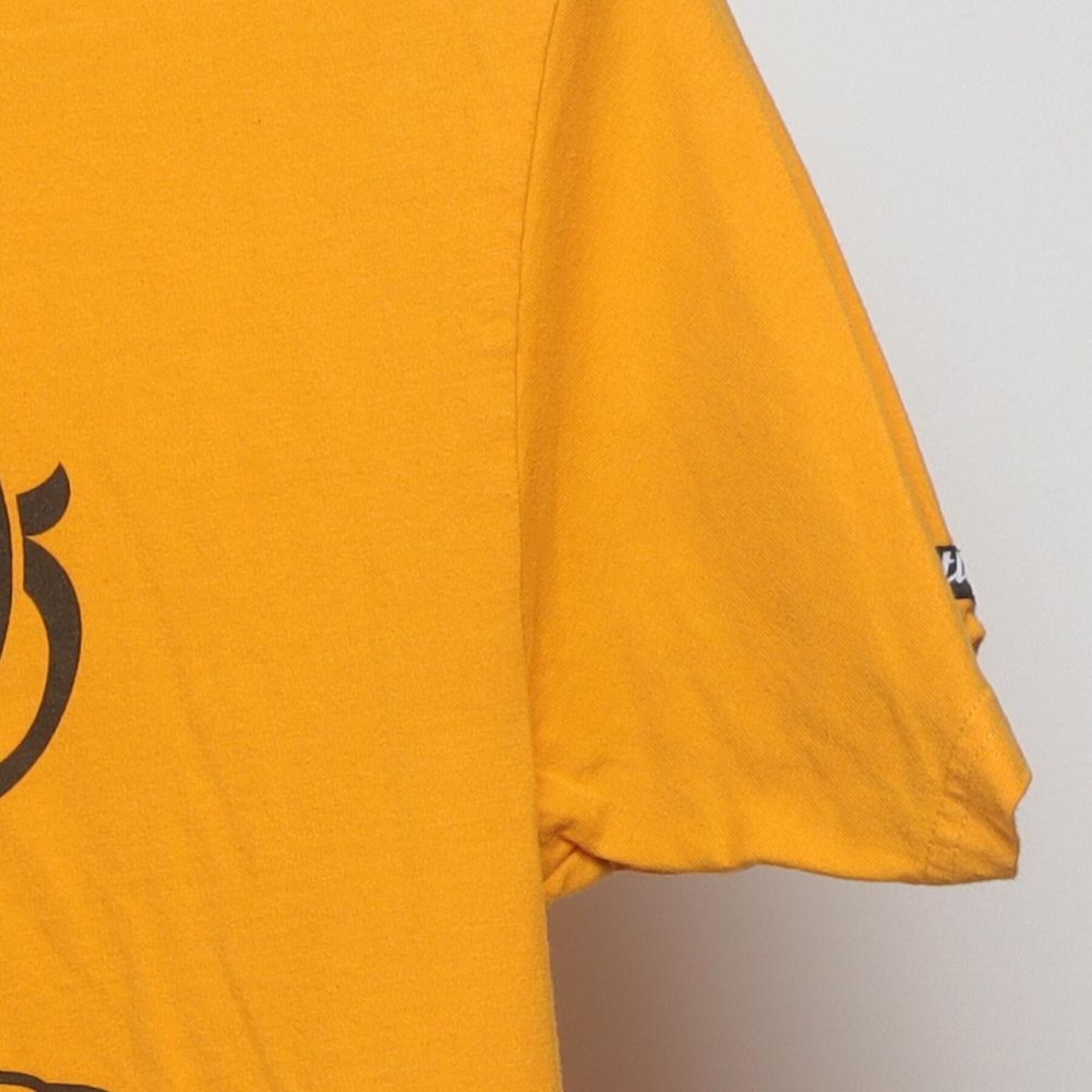 Close-up of the Right sleeve on the Vintage Y2K Crooks & Castles "Running Crook Mascot" T-Shirt - M