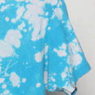Close-up of the sleeve on the Vintage Y2K Custom "Splatter Bleach Dye" T-Shirt - M