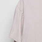 Close-up of the single stitch sleeve on the Vintage Y2K Fashion Nova "Live Fast Luxury Dreams" T-Shirt - L