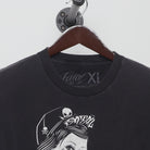 Close-up of the collar and tag on the Vintage Y2K Fatal "Tattoo Pinup" T-Shirt - XL