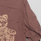 Close-up of the sleeve on the Vintage Y2K Graphic "Teddy Bear Pile" T-Shirt - L