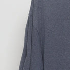 Close-up of the Left sleeve on the Vintage Y2K Unleash Break "Tribal Logo" T-Shirt - L