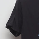 Close-up of the sleeve on the Vintage Y2K Michael Jackson "Moonwalker" T-Shirt - M