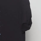 Close-up of the sleeve on the Vintage Y2K Michael Jackson "Moonwalker" T-Shirt - M