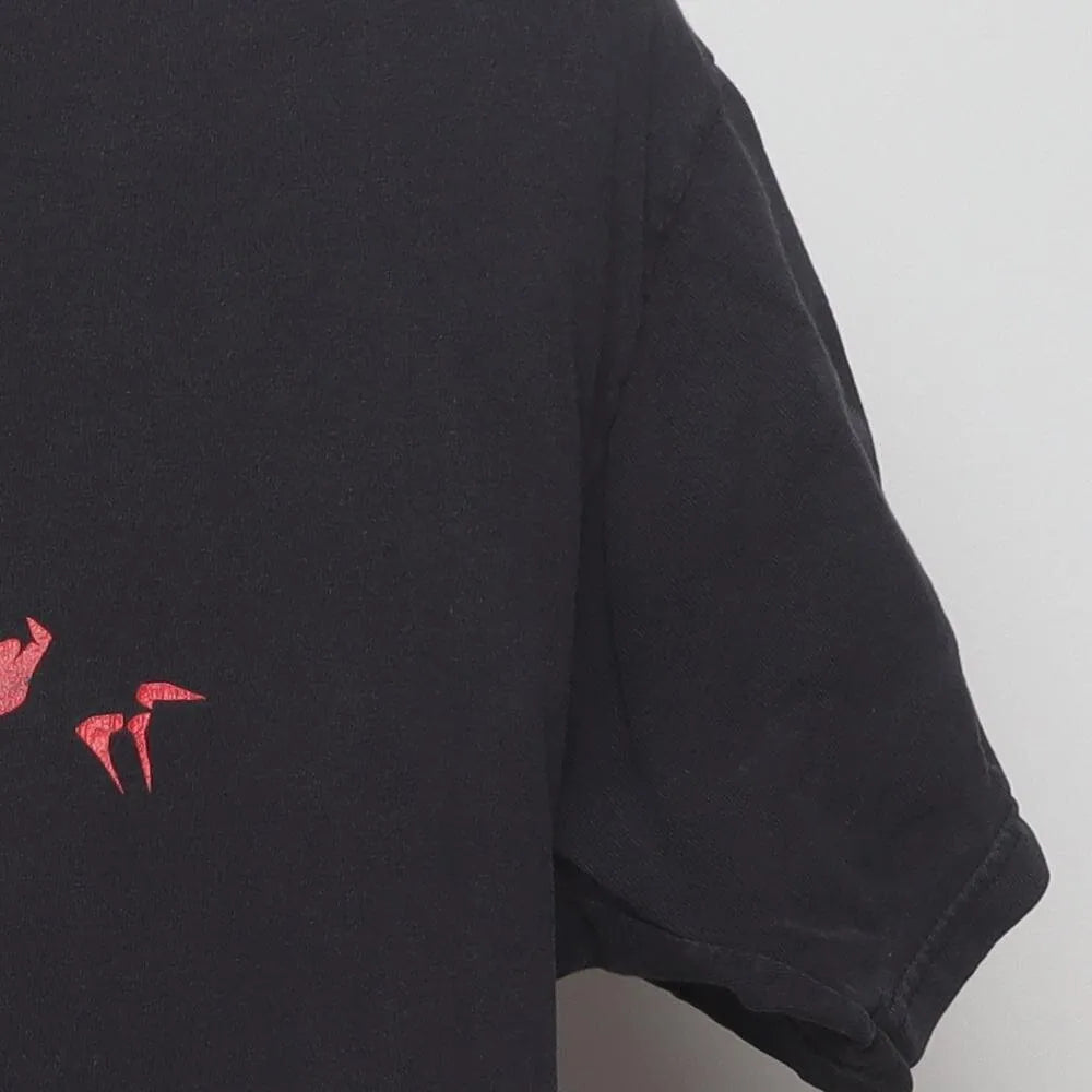 Close-up of the sleeve on the Vintage Y2K Michael Jackson "Thriller Zombie" T-Shirt - M