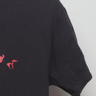 Close-up of the sleeve on the Vintage Y2K Michael Jackson "Thriller Zombie" T-Shirt - M