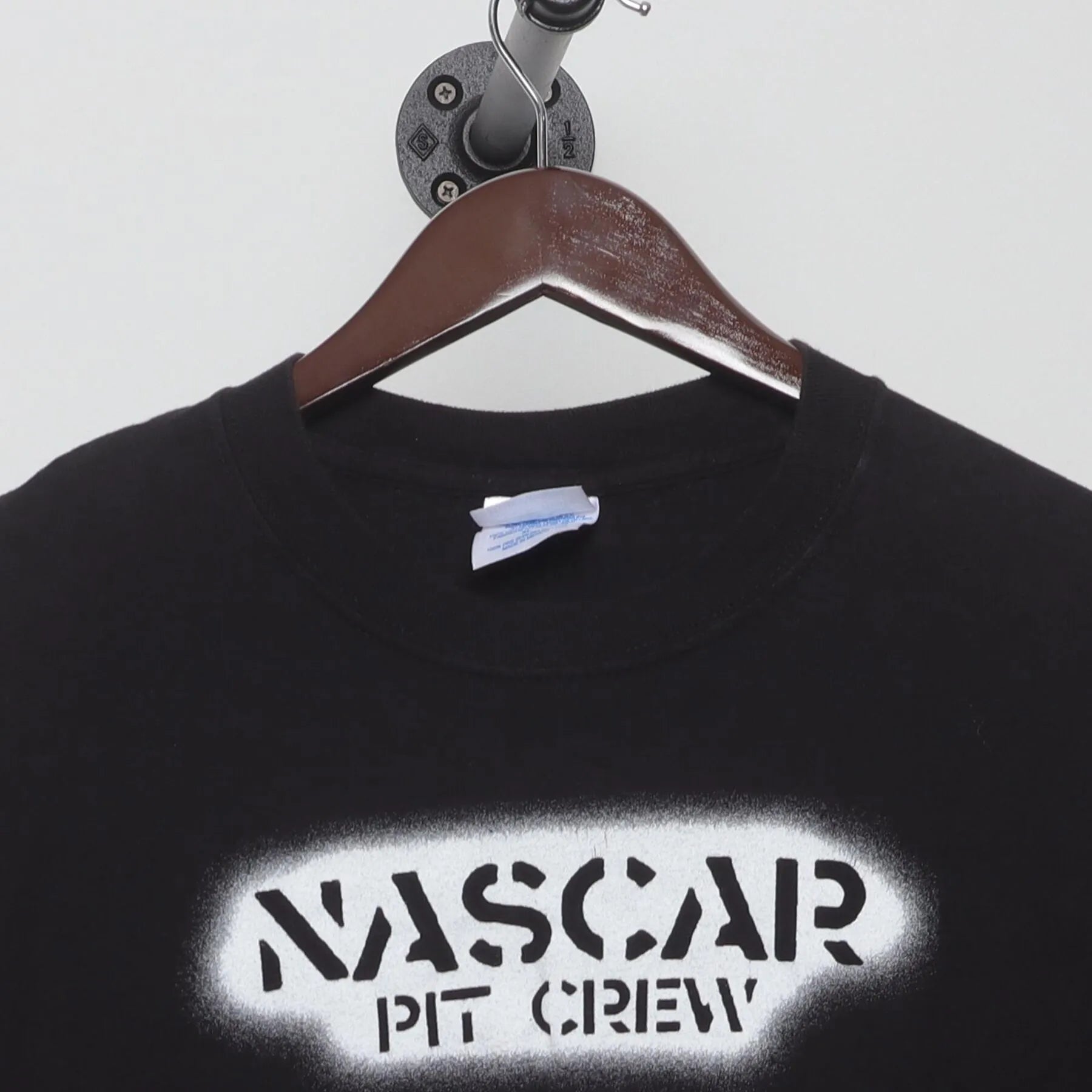 Close-up of the collar and tag on the Vintage Y2K NASCAR "Pit Crew" T-Shirt - L