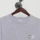 Close-up of the collar and tag on the Vintage Y2K Nike "Athletics Engineered for Performance" T-Shirt - L