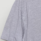 Close-up of the sleeve on the Vintage Y2K Nike "Athletics Engineered for Performance" T-Shirt - L