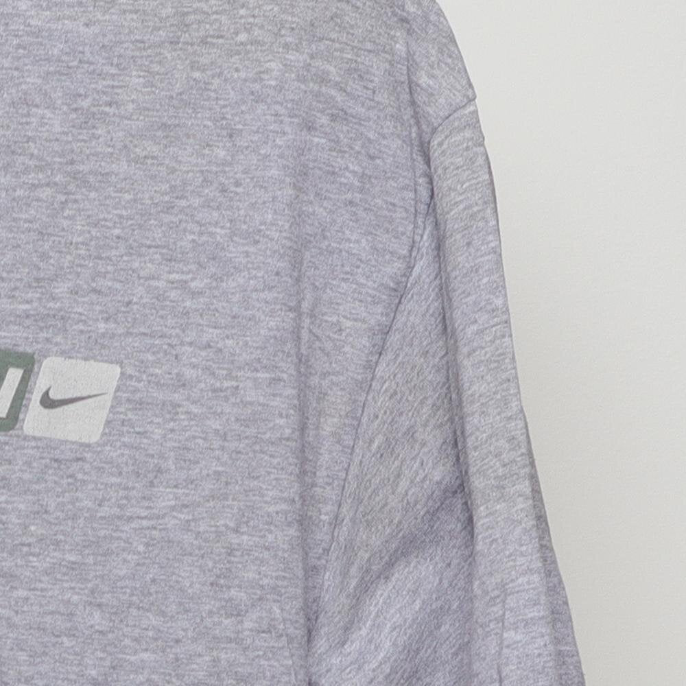 Close-up of the sleeve on the Vintage Y2K Nike "Athletics Engineered for Performance" T-Shirt - L