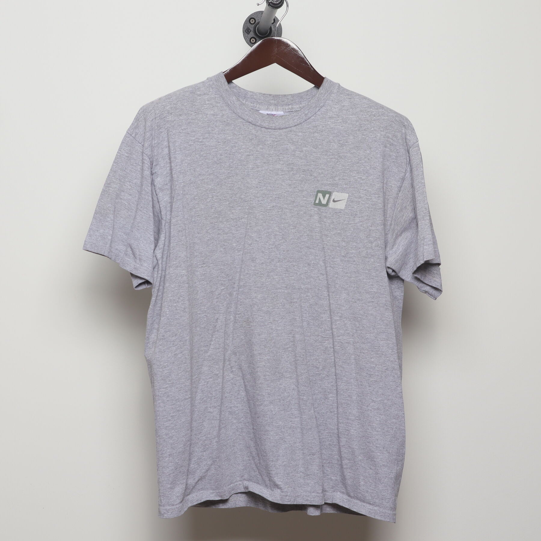 Front view of Vintage Y2K Nike "Athletics Engineered for Performance" T-Shirt - L