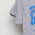 Close-up of the Left sleeve on the Vintage Y2K Popular Demand "Popular Demand" T-Shirt - XS