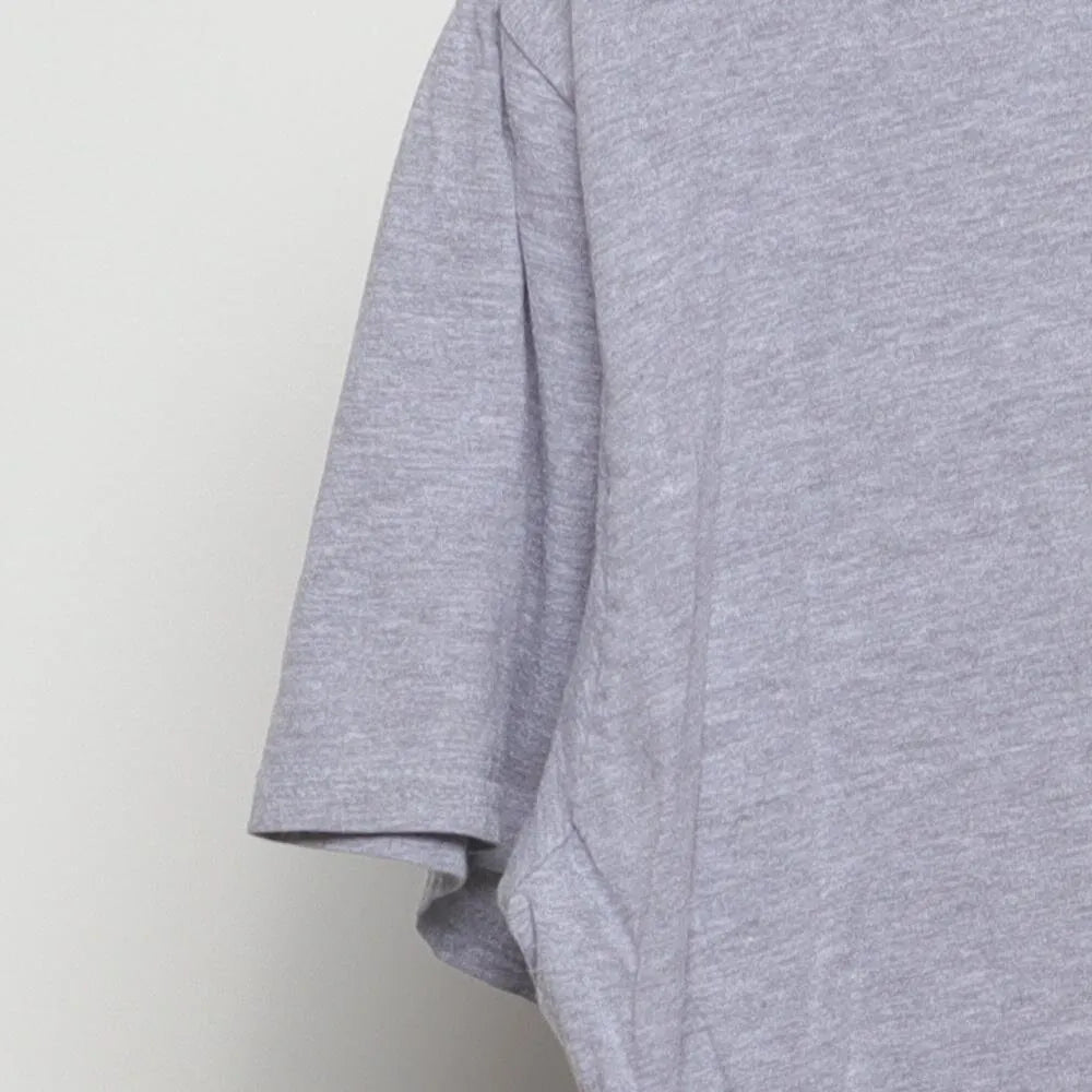 Close-up of the sleeve on the Vintage Y2K Purina "Checkerboard Logo" T-Shirt - M