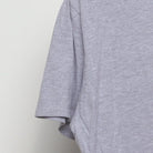 Close-up of the sleeve on the Vintage Y2K Purina "Checkerboard Logo" T-Shirt - M