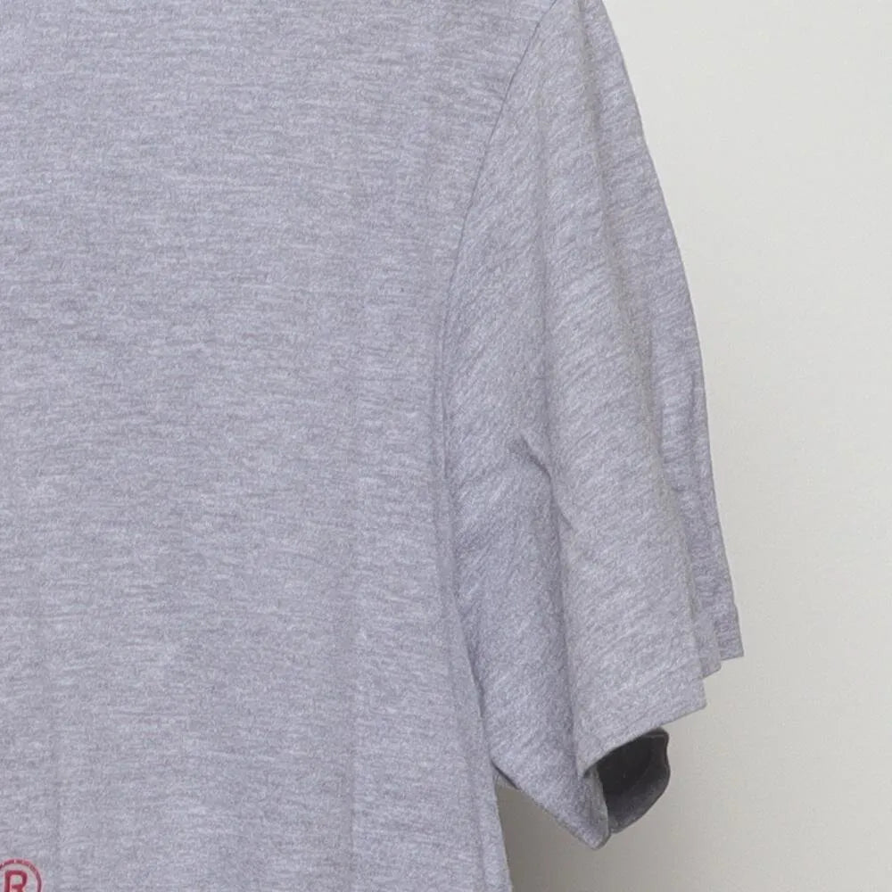 Close-up of the sleeve on the Vintage Y2K Purina "Checkerboard Logo" T-Shirt - M