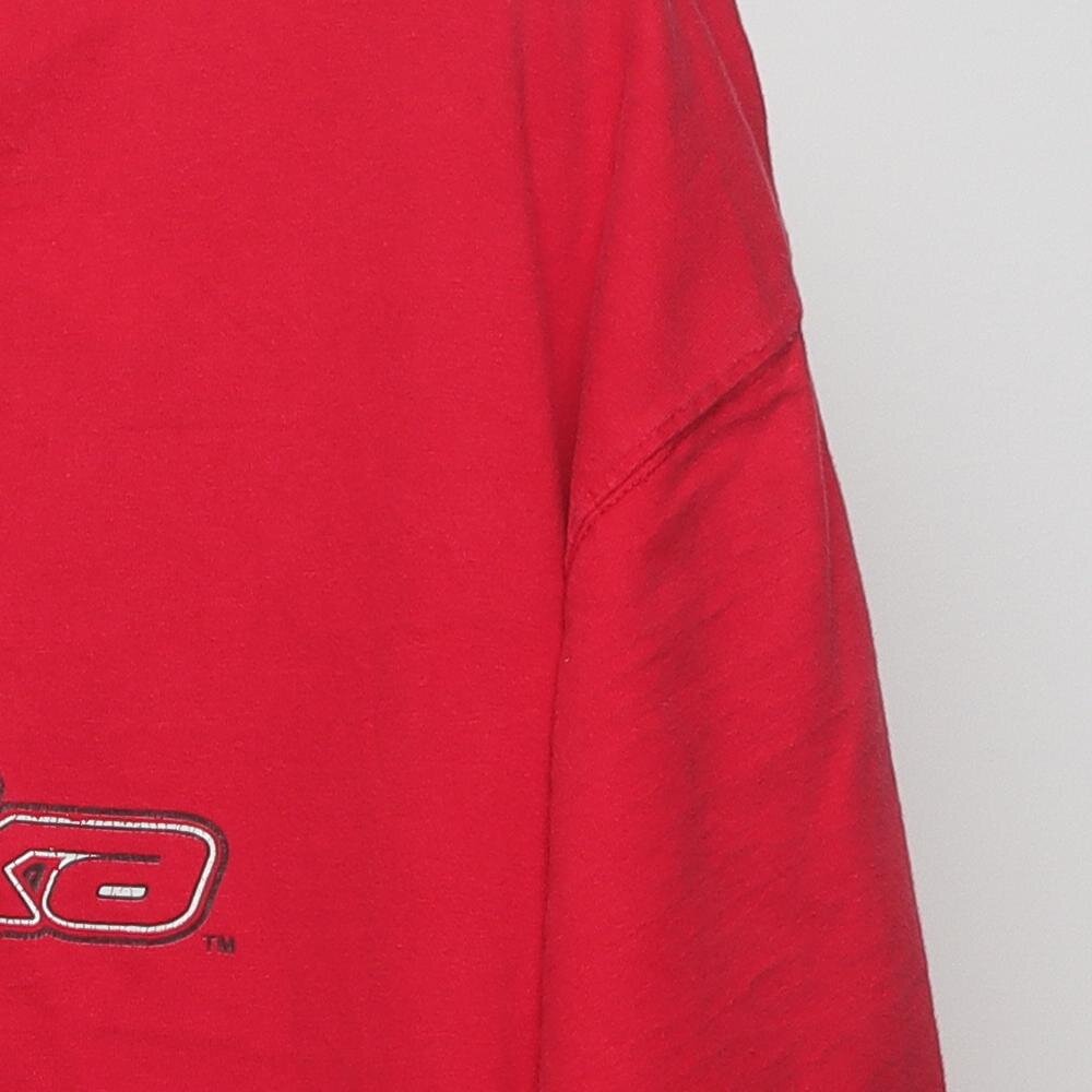Close-up of the sleeve on the Vintage Y2K Starter Nebraska Huskers "Big N Logo" T-Shirt - XL
