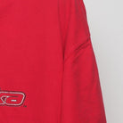 Close-up of the sleeve on the Vintage Y2K Starter Nebraska Huskers "Big N Logo" T-Shirt - XL