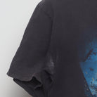 Close-up of the sleeve on the Vintage Y2K The Dark Knight "The Joker" T-Shirt - M