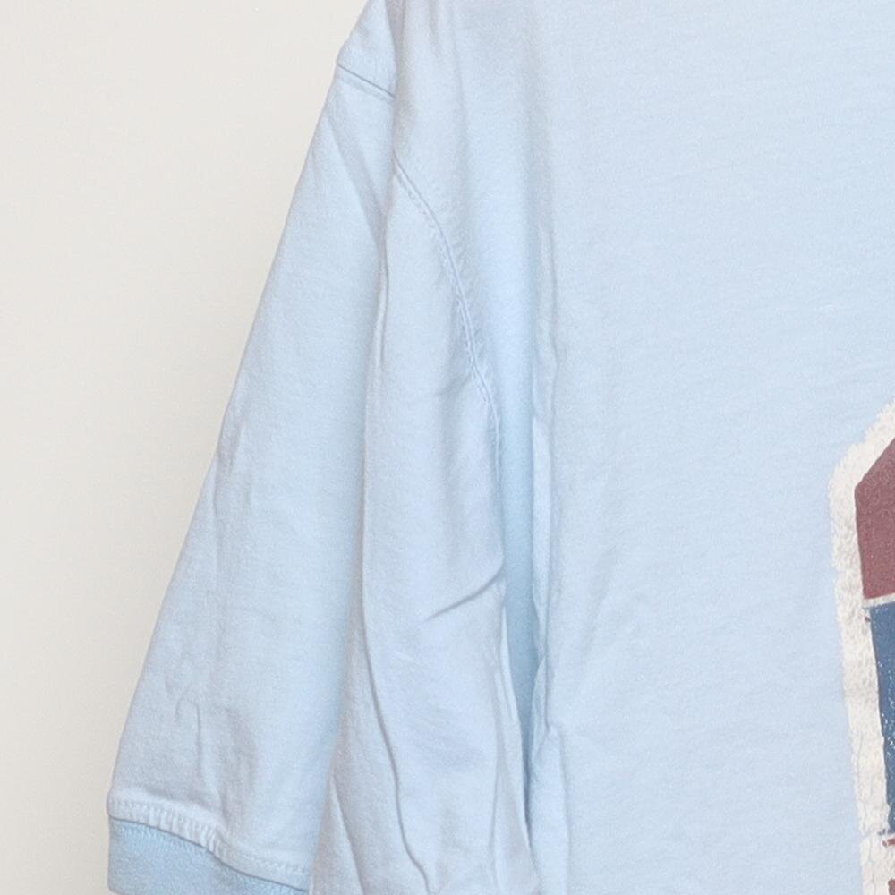 Close-up of the sleeve on the Vintage Y2K Tommy Bahama "Relaxation Specialist" T-Shirt - XL