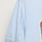 Close-up of the sleeve on the Vintage Y2K Tommy Bahama "Relaxation Specialist" T-Shirt - XL