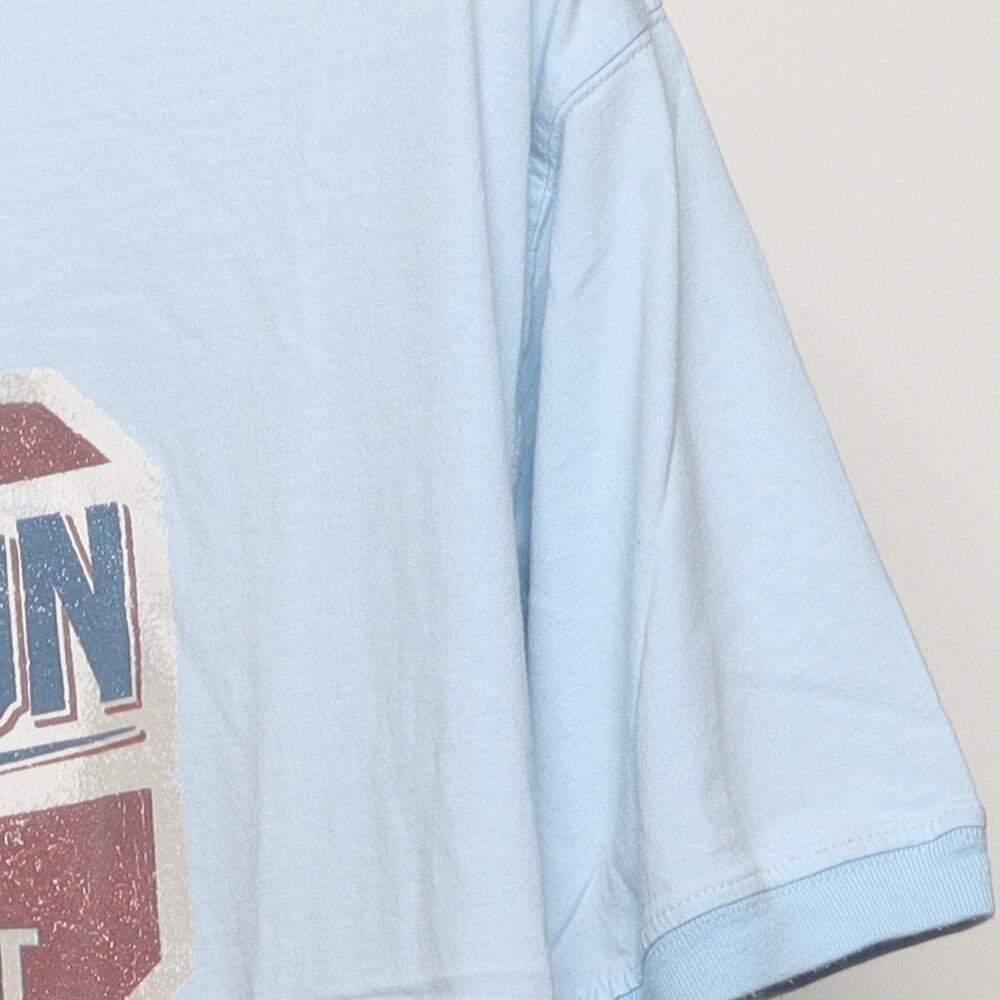 Close-up of the sleeve on the Vintage Y2K Tommy Bahama "Relaxation Specialist" T-Shirt - XL