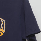 Close-up of the sleeve on the Vintage Y2K University of Michigan "Dynasty vs Wanna-Be" T-Shirt - L