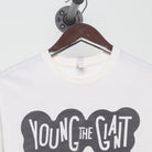Close-up of the collar and tag on the Vintage 2010s Young the Giant "Lounging Smoker" T-Shirt - XS