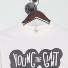 Close-up of the collar and tag on the Vintage 2010s Young the Giant "Lounging Smoker" T-Shirt - XS