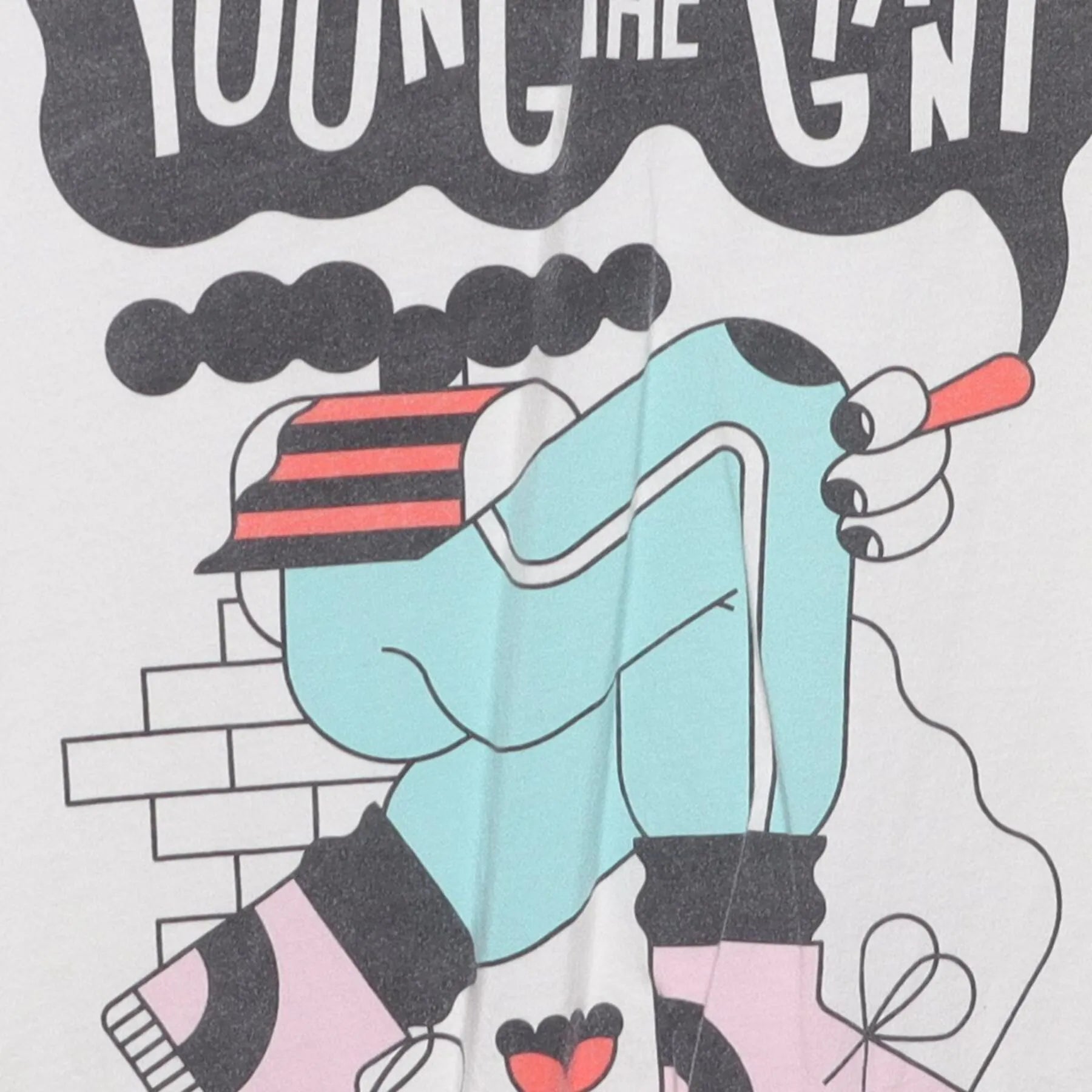 Close-up of the main graphic on the Vintage 2010s Young the Giant "Lounging Smoker" T-Shirt - XS