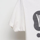Close-up of the Left sleeve on the Vintage 2010s Young the Giant "Lounging Smoker" T-Shirt - XS